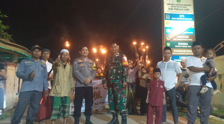 Bhabinkamtibmas Bersama Babinsa Desa Pangulah Baru Laksanakan Pengamanan Pawai Obor